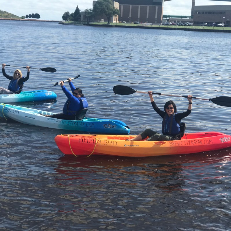a group of people on a boat in a body of water