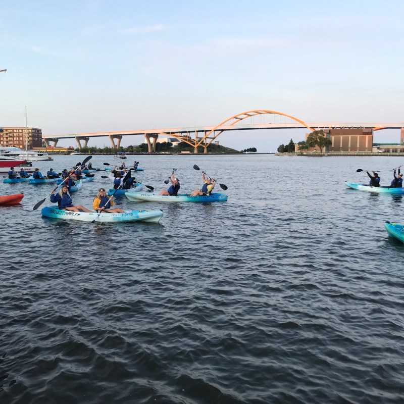 a group of people on a boat in the water
