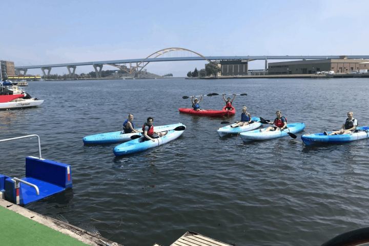 a group of people on a boat in a body of water